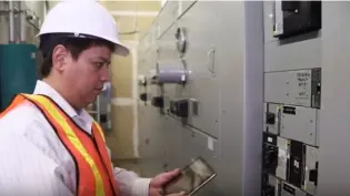 Facility manager reviewing equipment with tablet